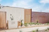 The façade is a composition of copper, brick and timber. Over time and in response to its coastal environment, the copper will develop a natural patina, going from deep brown to blue, eventually acquiring a greenish tone. 