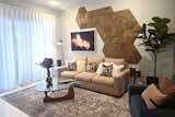 Living Room with 2D+3D wood art wall and jewel-toned furnishings and decor