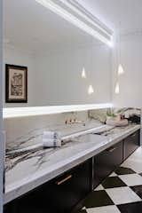 Powder Room-  using the champagne bronze on the Faucet and cabinet hardware contributed to the French romantic atmosphere.