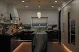 Kitchen- a mixture of modern simplicity and practical Asian lifestyle kitchen. The different levels of lighting allow the young couple to enjoy the space in different time of the day.