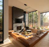Sunken living room with light infiltration from the large windows