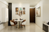 A Modern dining area with a sleek design. The space features a stylish white table with brown chairs, set against a backdrop of neutral walls and artwork. 