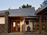 The design features a dynamic roof form with a subtly diagonal ridge, creating a compound curve that balances passive solar principles with site-specific needs. 