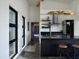 High ceilings, elongated layouts, and expansive openings enhance the perception of space, framing the natural beauty of Hawaii while maintaining a welcoming and airy atmosphere.