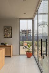 More than just a workspace—this marketing cabin offers visitors a front-row view of their future investment in progress from glass.