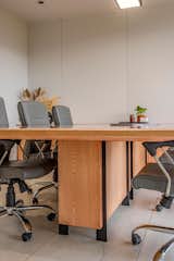 Sleek metal frames and a floating table add lightness and an edgy look to the space.