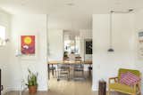 View from living room through dining room to kitchen, photo by Jenna Wakani