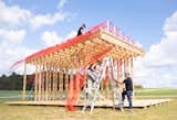 Pavilion assembly during BuildFest, installing mesh skin