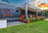 Pre-Cast Concrete BBQ + Expansive Terrace: This modern outdoor space is anchored by a striking ten-foot mahogany dining table, carefully crafted from reclaimed wood salvaged in the aftermath of the devastating Hurricane María in 2017. Showcasing the seamless integration of sustainable design, the table tells a story of resilience, giving new life to local materials and grounding the terrace in both beauty and meaning. Complemented by natural landscaping and a sleek container home aesthetic, the terrace celebrates a harmonious balance of modernity and heritage.