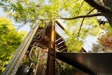 Wooden panels are set within an exposed steel structural exoskeleton.