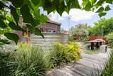 Featuring a stainless rainwater tank; the double garage, workshop, and studio are insulated and airconditioned, and the parking area includes 3-phase power for EV fast charging.