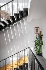 The light metal staircase finished in Jaisalmer stone, also plays a role in casting beautiful shadows, highlighting the artwork along the landings.