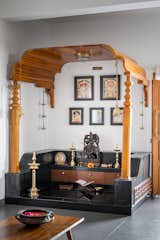 A puja space, defined by black oxide masonry, and a traditional jack-wood mantap sourced from Udupi.