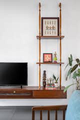 A charming TV unit adorned with intricately carved wooden balusters, blending functionality with timeless elegance.