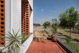 Stretching across the entire width of the site, this expansive balcony serves as a serene sanctuary, blending the comforts of home with the beauty of the outdoors.