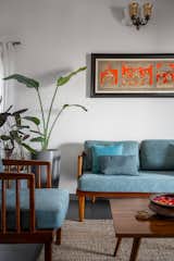 Traditional Indian art forms add character to the home, complemented by handcrafted decor and indoor plants.