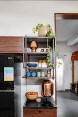 Open shelves and woven baskets add warmth and functionality to the space.