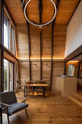 The douglass fir-clad walls of the A-frame are washed in the glow of the newly installed custom linear lights
