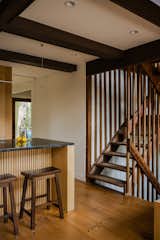 The kitchen details are in dialogue with the original stairs. Part of the stair battens had been concealed in a wall and were discovered during demolition