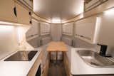 The rear of the Polydrops P21 includes a kitchen and a queen-size bed that can be converted into a lounge area.