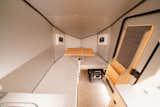 The front of the Polydrops P21 features a kid's bed that doubles as a convertible lounge area.