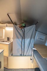 Convertible shower and toilet designed to maximize space usage 03