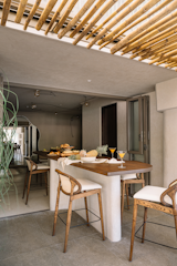 The open-plan dining layout, designed to speak to the owners’ magnanimous nature and Malabari heritage, keeps the space connected to both the living room and the deck.