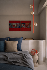 The primary bedroom is a soothing sanctuary that echoes the home’s overarching vanilla cream palette. The bed and floor were born in the same breath as a monolithic terrazzo installation.