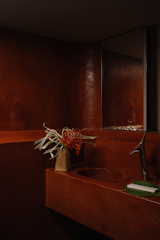 The powder room is a red velvet dream.
 