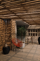 The design allows the deck to function as an integral part of the home, bringing in natural light, fresh air, and the sights and scents of the coconut and mango trees, spices, and rain,