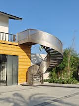 Elemental curve staircase with perforated MS railing
