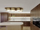 The atmosphere created by the soft strip above the kitchen counter and shapes of the pompous cylindrical ceiling lights transform cooking in the kitchen into enjoying life aboard a yacht.