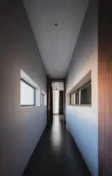 Stacked geometries in neutral tones; interplay of solid and void evokes restraint and openness.