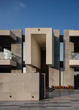 A refined box form lifted from the ground plane; crisp material palette and sharp-edged detailing.