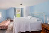the blue bedroom with direct view to the gardens