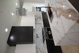 Using Eco-Quartz made from recycled materials, the kitchen design emphasizes the sustainable building principles this home was constructed with 