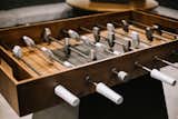 Our luxury foosball table features a beautiful blend of hand-finished Guanacaste wood and metal that has been manually aged. A sophisticated and modern take on a classic game. 