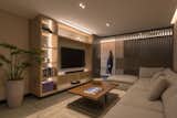 The family room is permeable and cinematic because of a latticework.
