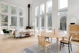 The space is illuminated by natural light streaming in through large windows, creating a warm and inviting atmosphere.