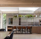 This kitchen is a stunning blend of industrial and natural elements. 