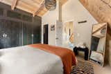 The secluded loft master suite offers a king bed and an ensuite bathroom.