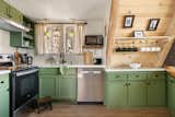 Our open-concept kitchen, dining, and living area offers seamless flow, perfect for gathering. Cook with ease in the fully stocked kitchen, while enjoying the wood-burning fireplace and scenic views. 