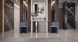 This stunning modern entryway interior exudes refined elegance, blending luxurious marble finishes, rich wood textures, and minimalist decor for a truly high-end aesthetic. The space is defined by contrasting black and white marble wall panels, which add dramatic depth and visual interest to the overall design.

A sleek console table with metallic detailing sits at the center, paired with velvet blue ottomans and modern accent chairs, offering a perfect balance of functionality and sophistication. The monochromatic abstract wall art above the console anchors the space, while soft backlighting enhances the ambiance with a warm, welcoming glow.

This interior is ideal for homeowners and designers looking for entryway inspiration, showcasing how modern luxury can be both striking and inviting. Every detail—from the geometric rug pattern to the sculptural decor—has been thoughtfully curated to reflect the best of contemporary home design.