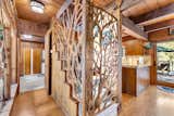Renowned local artist Dore Capitani created sculpted metalwork to enclose the stairs leading to the loft—a private creative space once used by Dolly.