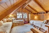 Tucked beneath soaring beams, the loft features three built-in beds and cozy nooks—rumored to be one of Dolly’s favorite spots to write and unwind.
