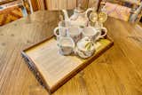 A delicate tea set gifted to Dolly, complete with a heartfelt note—just one of many personal touches that make this home a truly special part of her story.