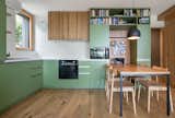 Kitchen view with natural light and material contrast.