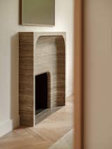 Bespoke travertine fireplace designed by our studio