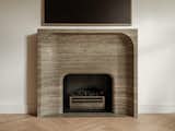 Bespoke travertine fireplace designed by our studio
