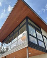Detail of window wall, yakisugi siding, and tongue-and-groove fir soffit 